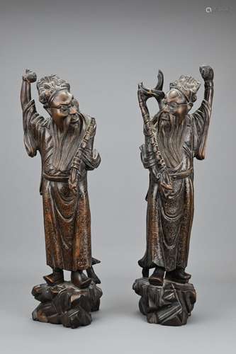 A PAIR OF CHINESE CARVED WOOD AND SILVER WIRE INLAY FIGURES,...