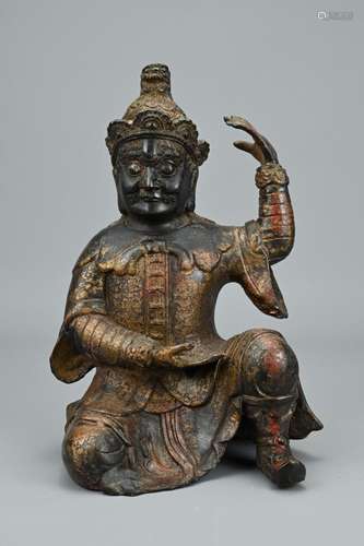 A CHINESE TIBETAN GILT AND LACQUER BRONZE FIGURE. Of a warri...