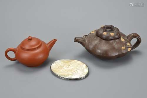 TWO CHINESE YIXING POTTERY TEA POTS AND MOTHER OF PEARL COVE...