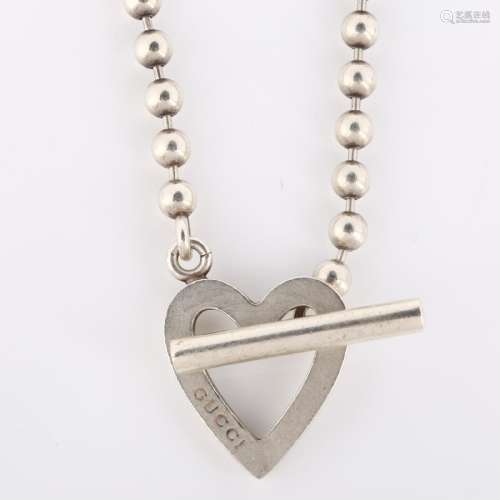 GUCCI - an Italian sterling silver heart toggle necklace, wi...