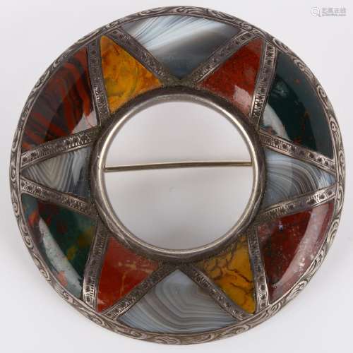 A 19th century Scottish hardstone brooch, unmarked silver cl...