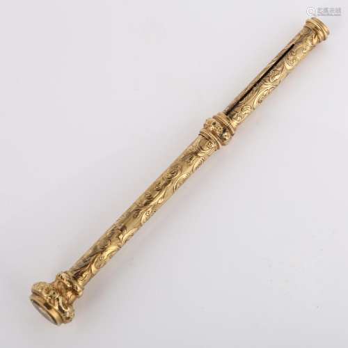 A 19th century propelling pencil, unmarked yellow metal sett...
