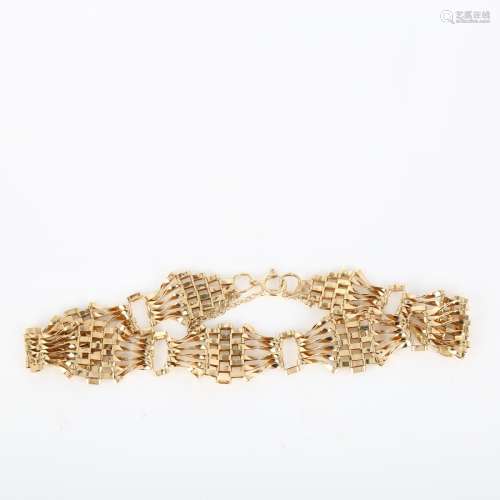 A late 20th century 9ct gold gatelink bracelet, length 18cm,...