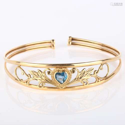 A modern 9ct gold blue topaz heart torque bracelet, openwork...