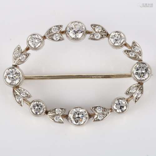A Belle Epoque diamond brooch, openwork oval form with flora...