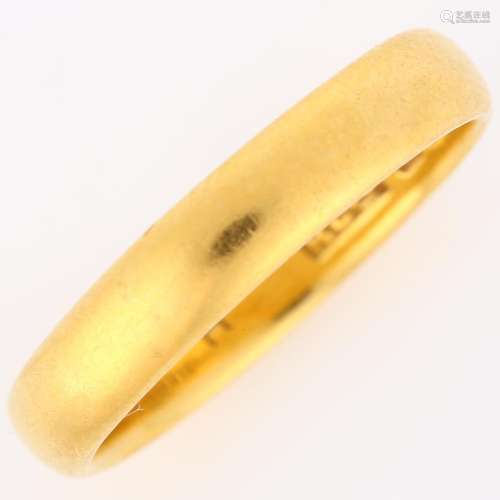 An early 20th century 22ct gold wedding band ring, maker`s m...