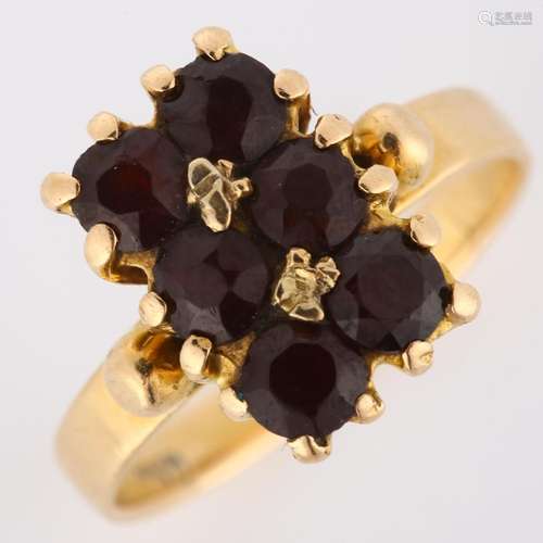 An 18ct gold Bohemian garnet dress ring, set with round-cut ...