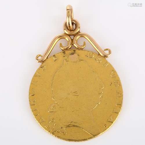 A George III 1793 gold spade guinea, with soldered unmarked ...