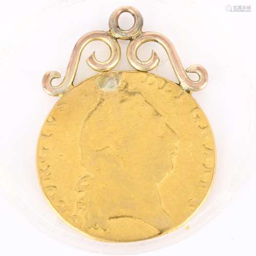 A George III 1798 gold spade guinea, with soldered unmarked ...