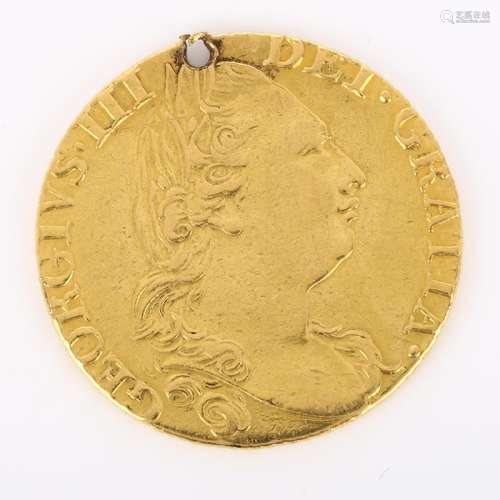 A George III 1782 gold guinea coin, 8.2g Coin has been pierc...