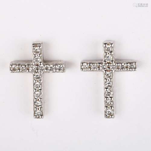 A pair of 18ct white gold diamond cross earrings, set with m...