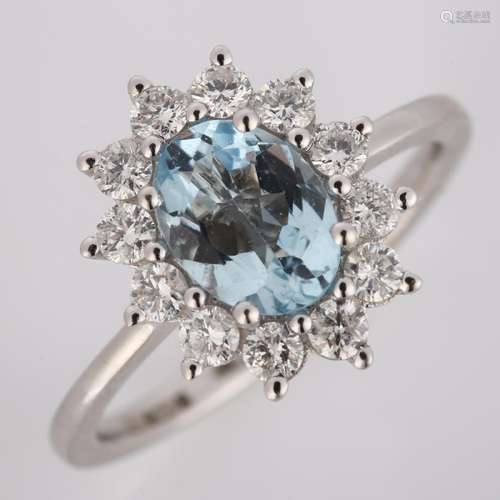 A modern 18ct white gold aquamarine and diamond cluster ring...