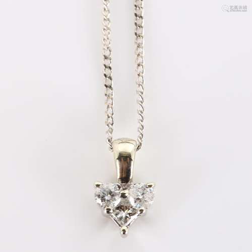 A modern 9ct white gold diamond spade pendant necklace, on 9...