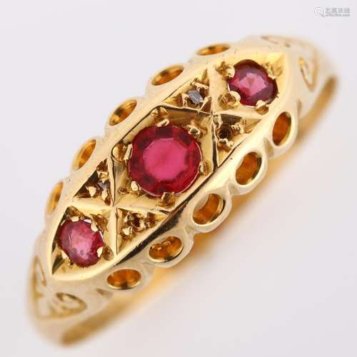 An early 20th century 18ct gold ruby and diamond half hoop r...