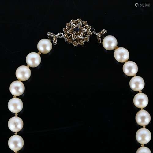 A late 20th century single-strand pearl necklace, with 18ct ...