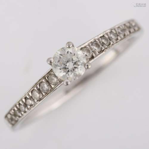 A platinum 0.34ct solitaire diamond ring, prong-set with mod...