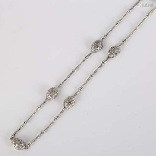 A modern 18ct white gold diamond bracelet, fine curb links w...