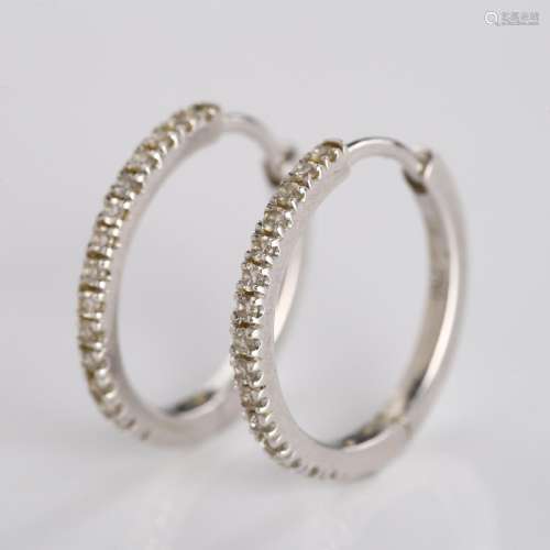 A pair of 18ct white gold diamond hoop earrings, set with mo...