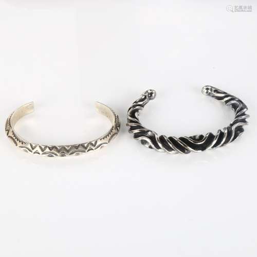A Mexican silver torque bangle, 33.4g, and a Continental unm...