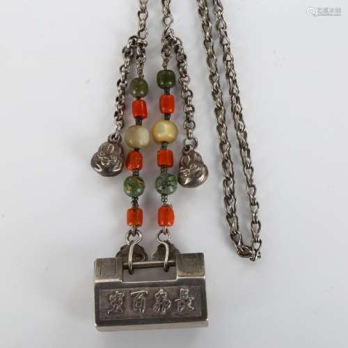 A Chinese silver padlock pendant necklace with coral and mot...