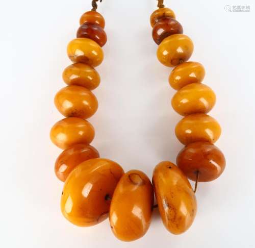 A large Tribal prayer bead necklace, probably Bakelite, larg...