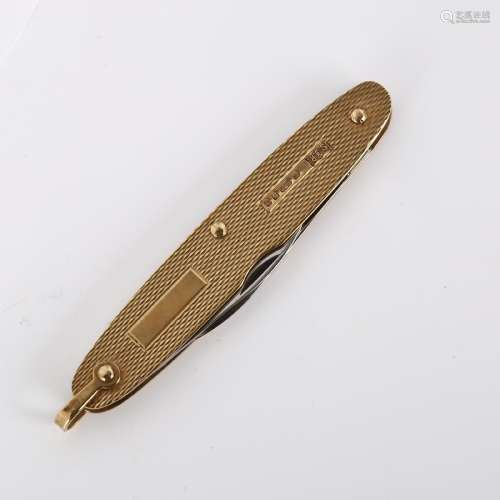 A late 20th century 9ct gold penknife, allover engine turned...
