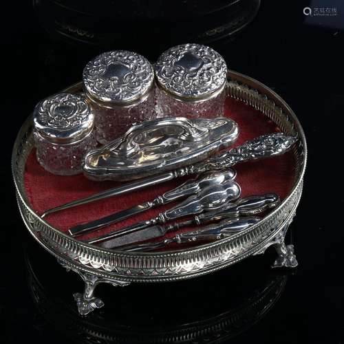 Various silver dressing table items, including manicure and ...