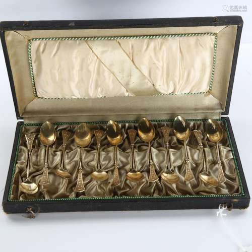 A set of 12 Continental silver teaspoons, with relief flamin...