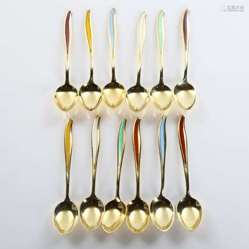 ABSA - a set of 12 Danish vermeil sterling silver and harleq...