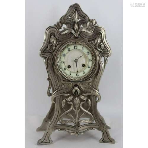 An Art Nouveau Silvered Metal Clock.