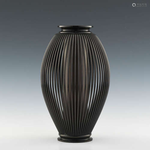A Japanese Art Deco two-part bronze ikebana vase
