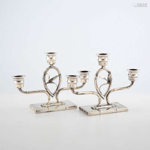 A pair of Japanese sterling silver candle stands