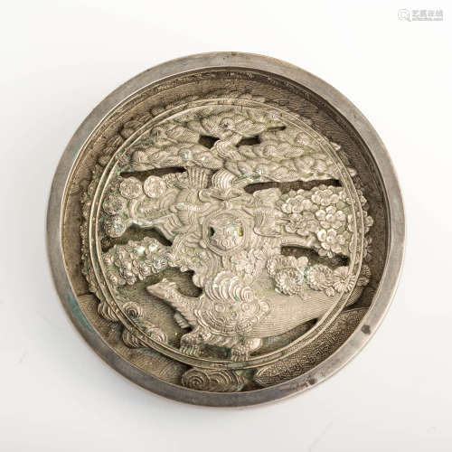 A Japanese bronze mirror, signed Izu (no) kami