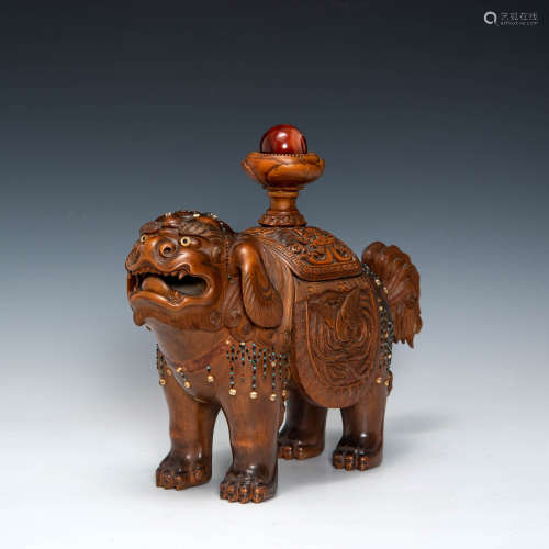 A Japanese carved and inlaid boxwood foo, Meiji