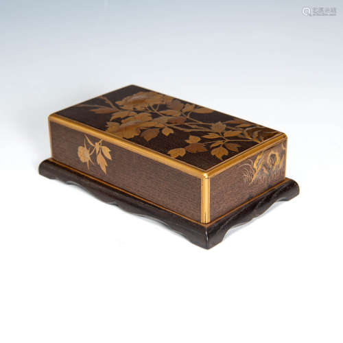 A Japanese inkstone in gold lacquered wooden box