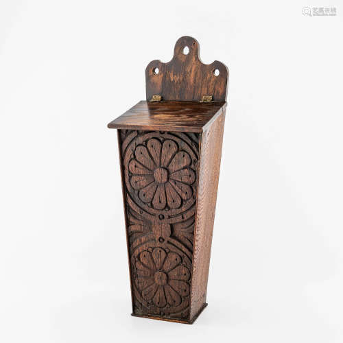 An English carved oak hanging candle box, first-half 19th ce...