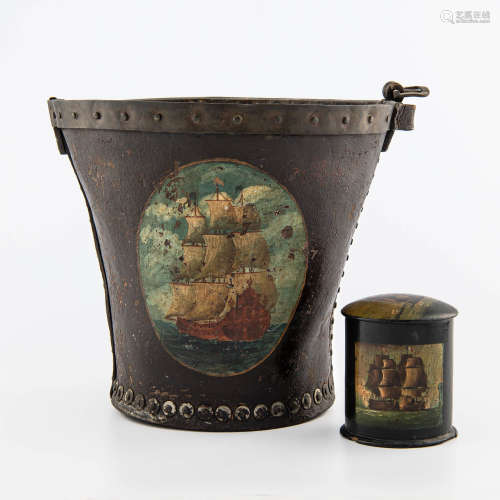 An English brass bound leather fire bucket and lacquer tea c...