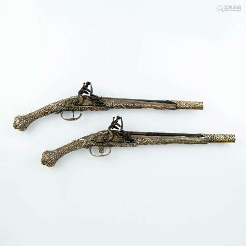 A pair of Ottoman gold-inlaid miquelet lock pistols, circa 1...