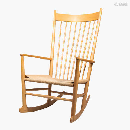 A Danish Modern maple Model J16 rocking chair with corded se...