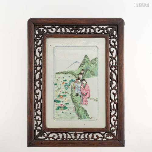 A Chinese famille rose porcelain plaque in a carved hardwood...