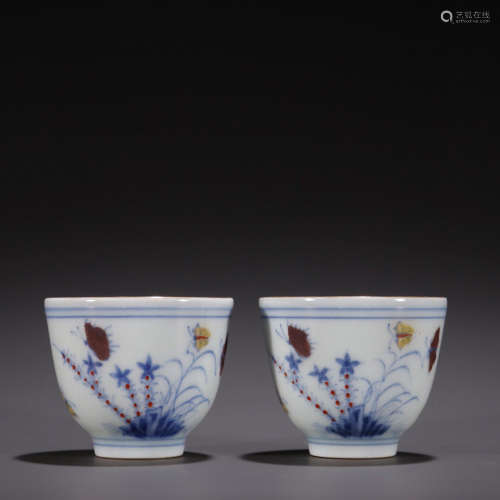 A pair of blue and white glazed red gold glazed butterfly cu...