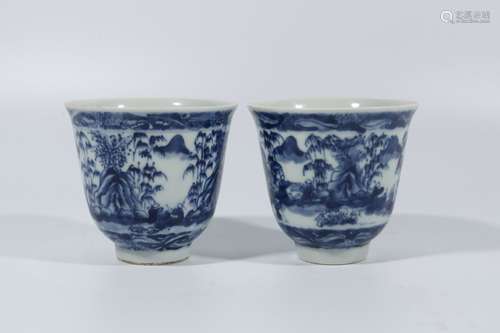 A pair of blue and white landscape cups