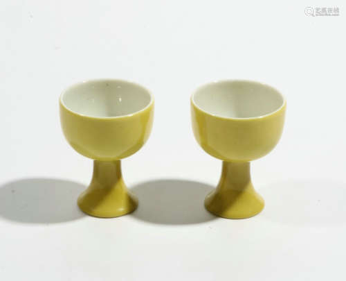 Pair of yellow glazed tall cups