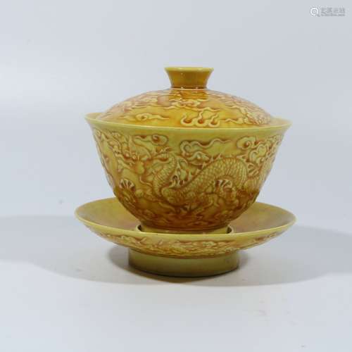 A set of yellow glazed dragon teacups