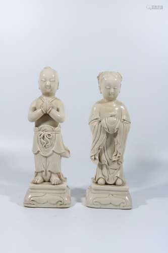 A pair of white glaze boys and girls