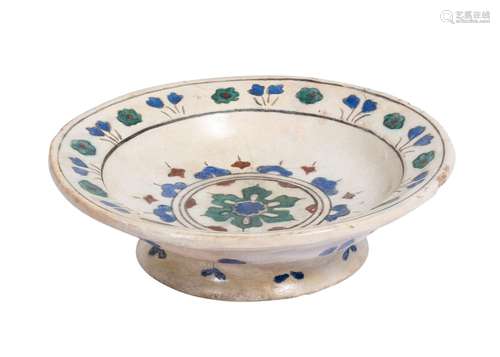 A EARLY FOOTED IZNIK FLORAL DISH, CIRCA 1520-1530, 16TH CENT...