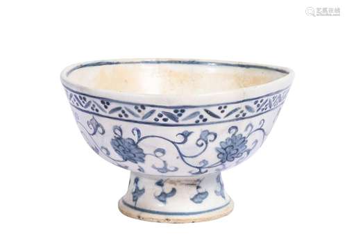 A EARLY FOOTED IZNIK BLUE & WHITE FLORAL BOWL, CIRCA 152...