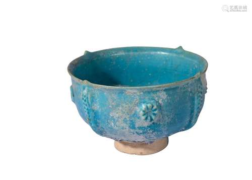 AN INTACT SELJUK TURQUOISE GLAZED LUSTRE POTTERY FOOTED BOWL...