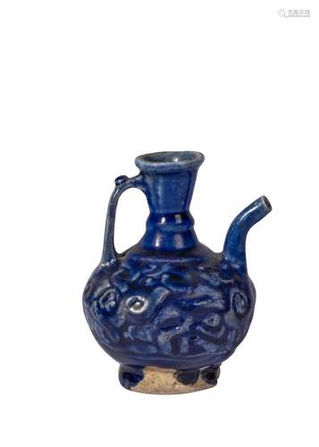 A COBALT BLUE MOULDED GLAZED KASHAN EWER WITH HANDLE, 12TH C...