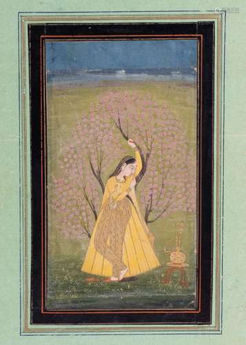 AN INDIAN MINIATURE OF A LADY LEANING ON A BLOSSOM TREE, 19T...